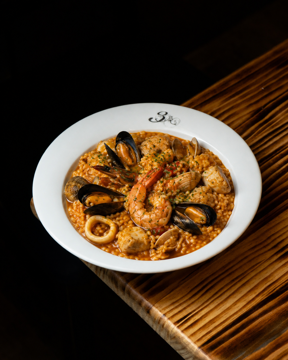 Arroz meloso con mariscos de temporada